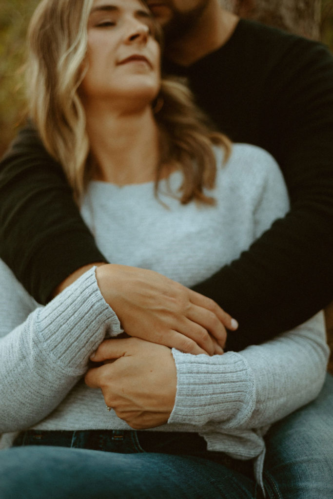 Stillwater, Minnesota Fall Engagement Photos with Couple in Tall Pine Trees